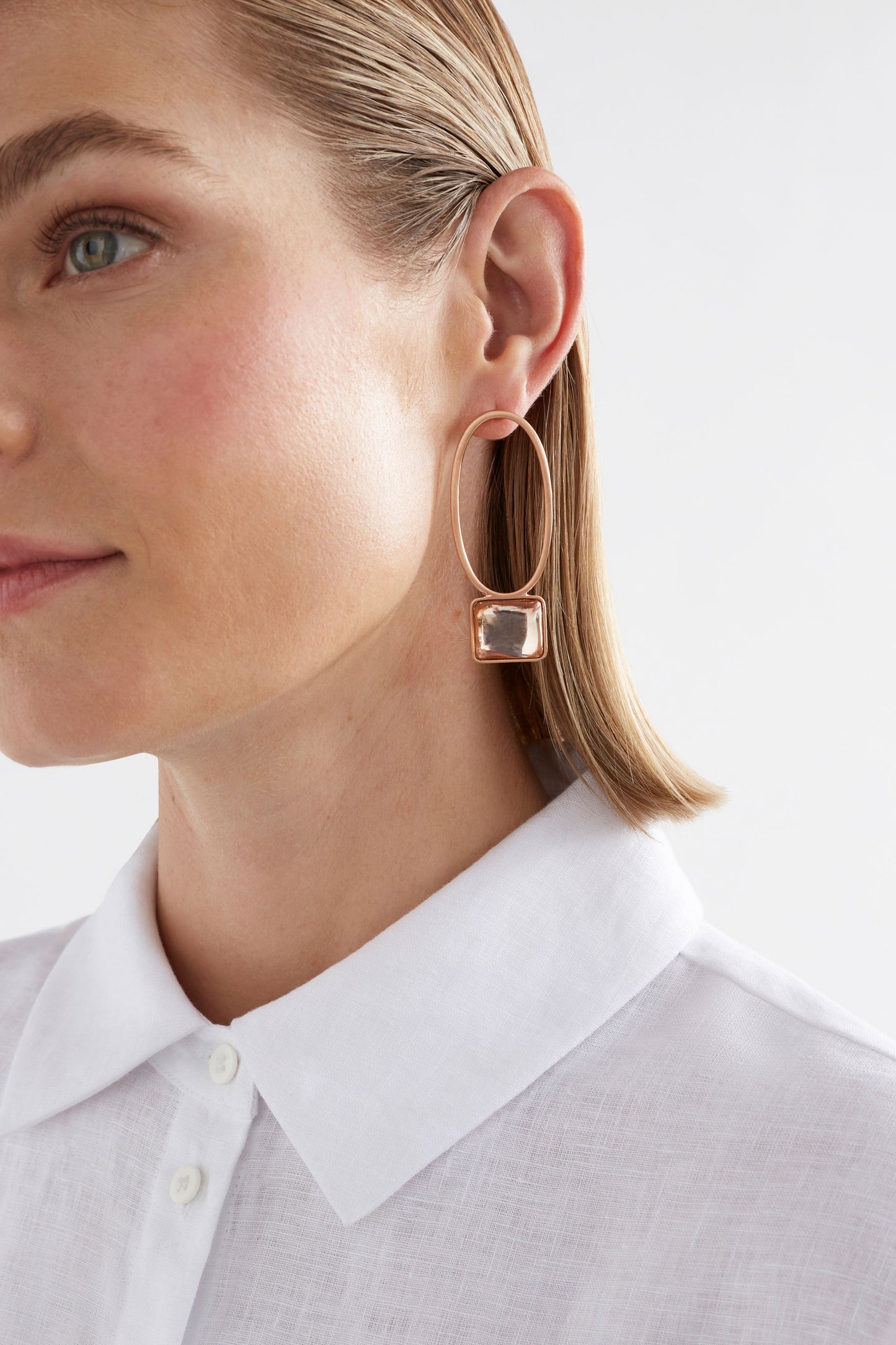 Stal Brushed Metal Drop Stud Earring with Coloured Glass Jewel Detail Model Crop | CHAMPAGNE