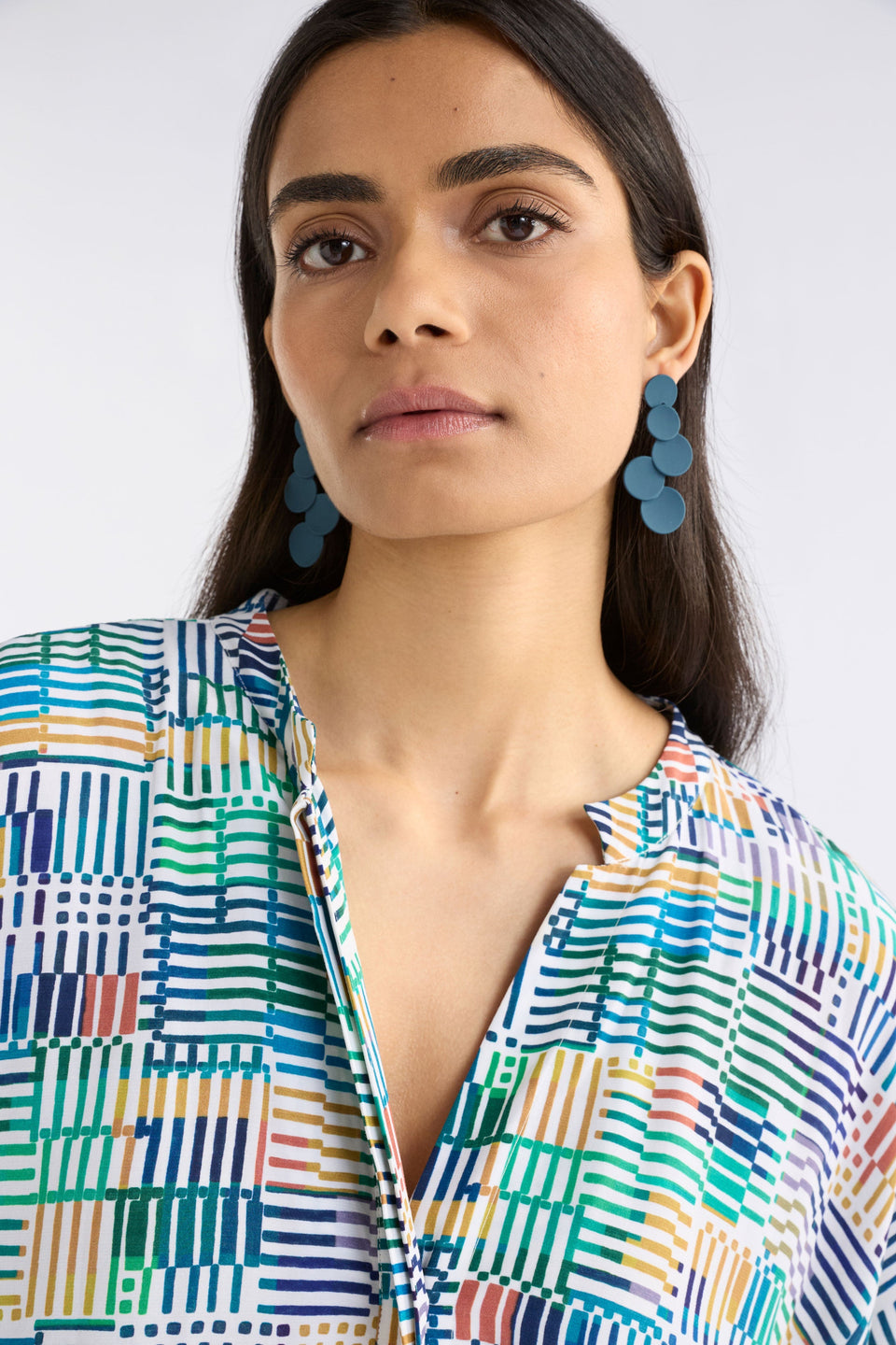 The Tallke Drop Earring features overlapping sculptural circles in an elongated form with a matte rubberised finish for playful impact ELK | SLATE BLUE