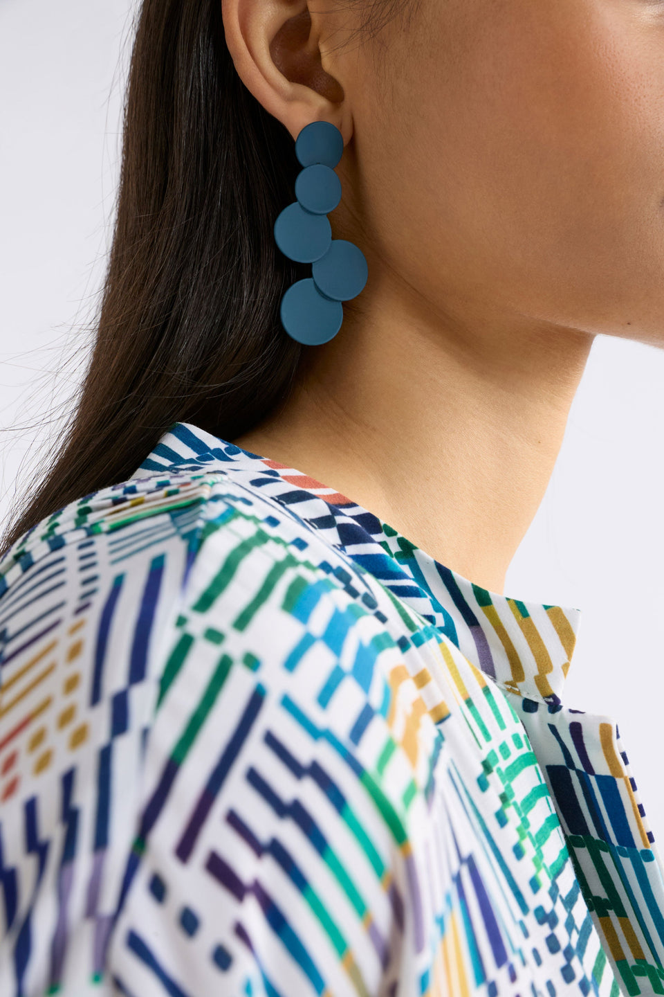 The Tallke Drop Earring features overlapping sculptural circles in an elongated form with a matte rubberised finish for playful impact ELK | SLATE BLUE