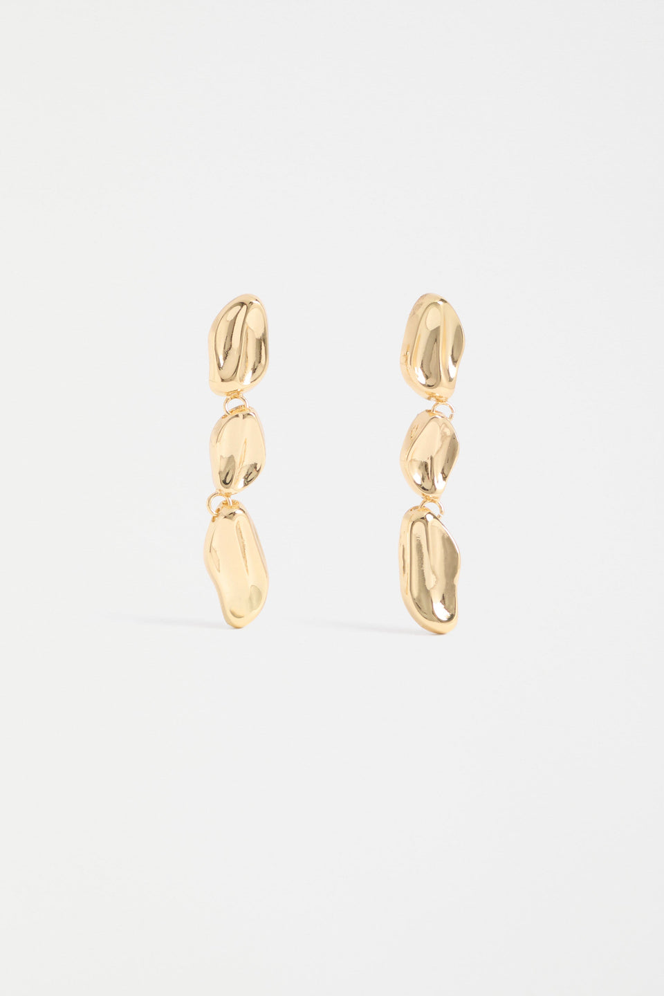 The Delaa Drop Earring features three sculptural rounded shapes linked for soft, organic movement ELK | GOLD
