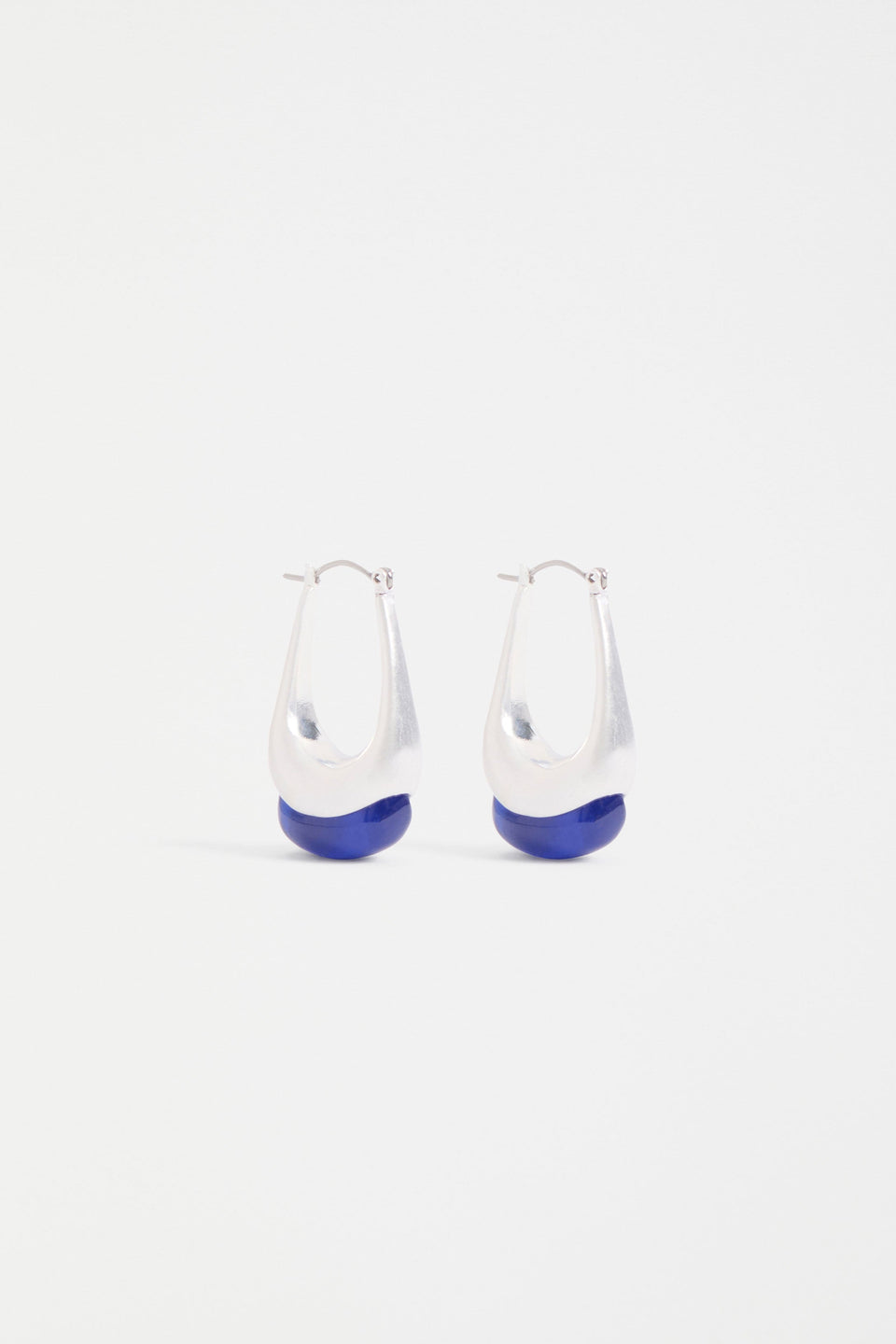 The Korvvo Long Hoop Earring features a sculptural elongated hoop with dramatic length, finished with a chunky flecked glass bead ELK | BLUE