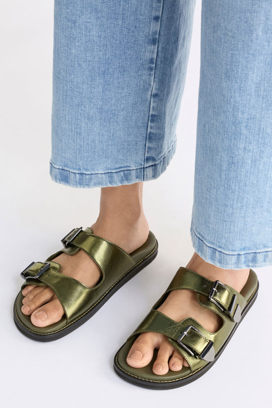 The Spenne Sandal features dual buckled foiled leather straps with tonal western hardware in a metallic slide design ELK | OLIVE