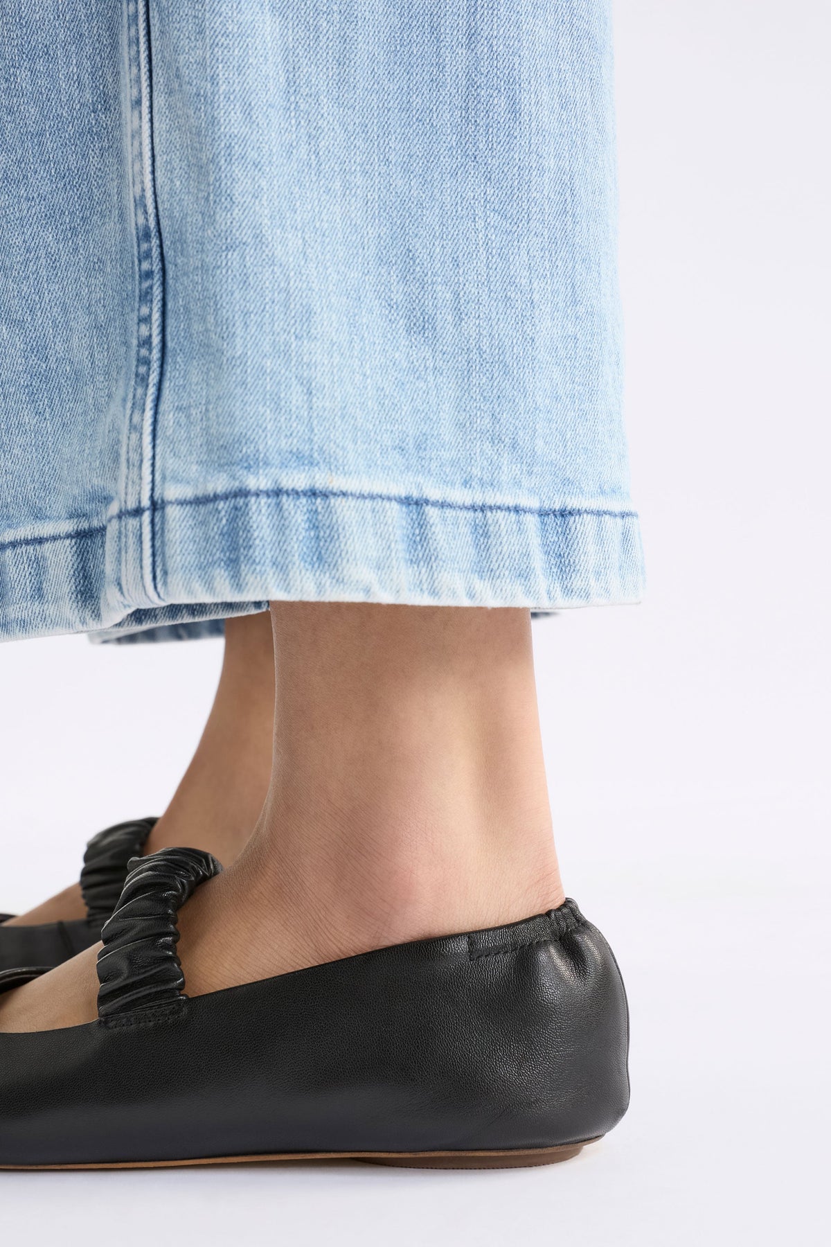Kuren Ballet Flat Shoe on model close up of heel and strap detail | BLACK