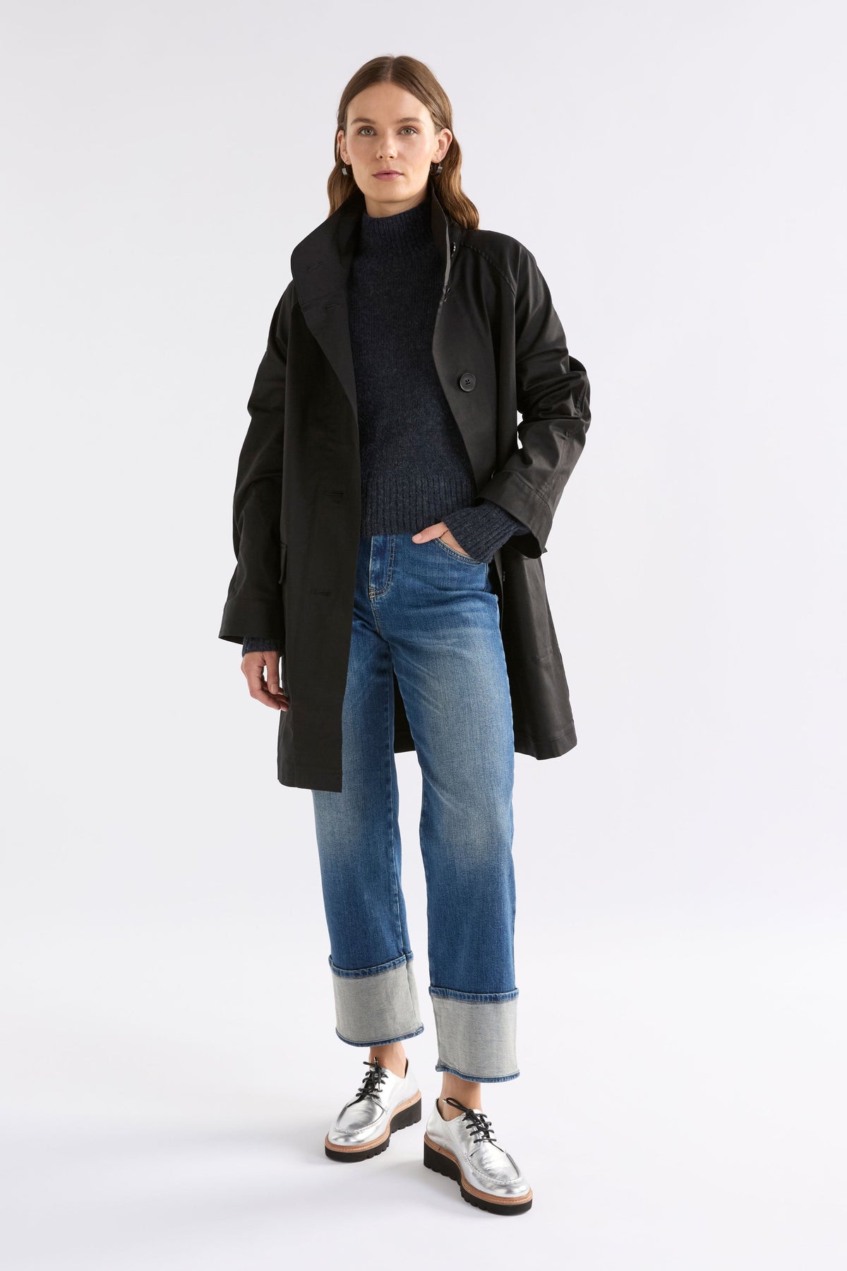 Enka Neat Fit Funnel Neck Sweater Model Front with Noorden Coat | CARBON