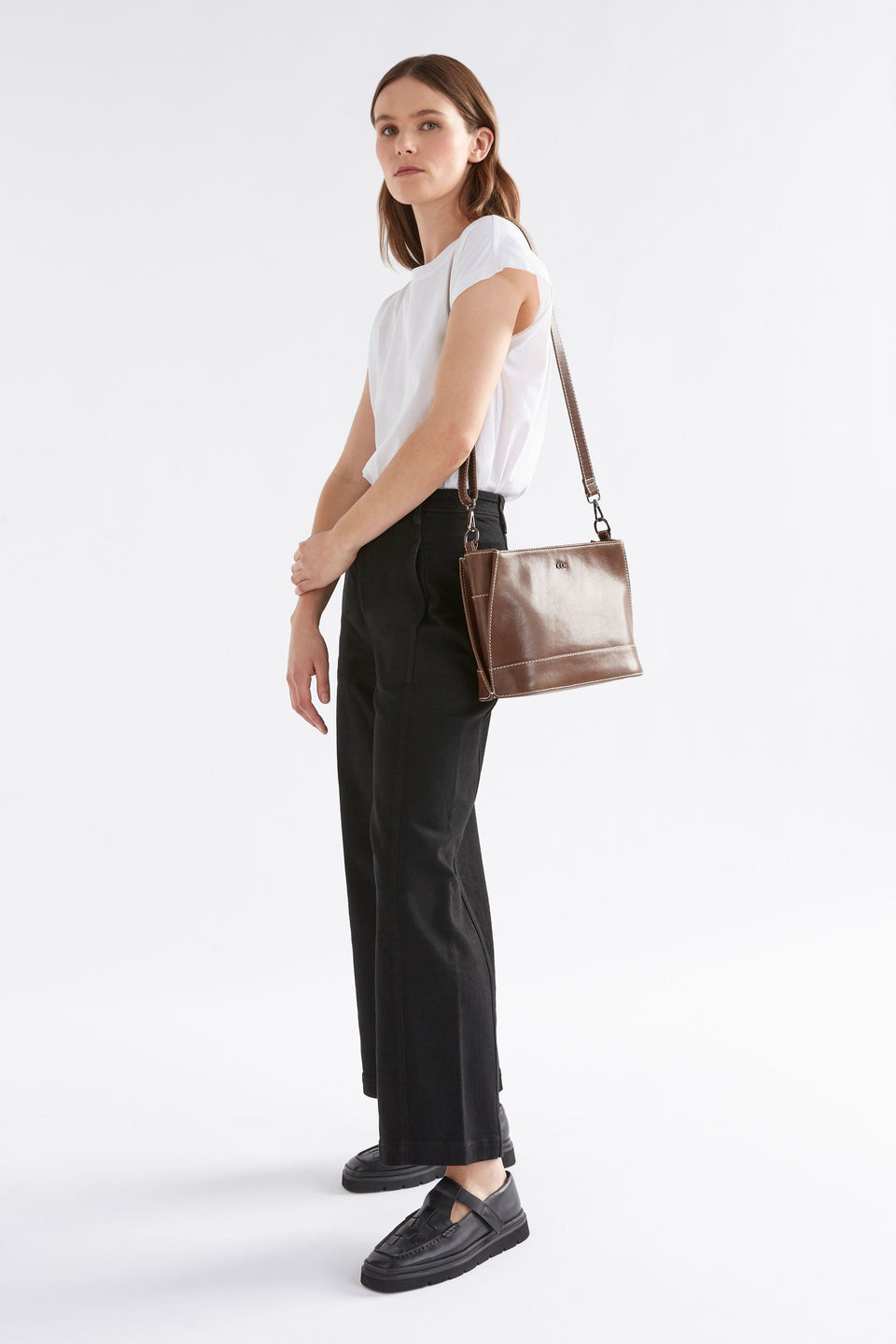 Fika Mid Sized Leather Zip up Handbag Front model full body | TAN