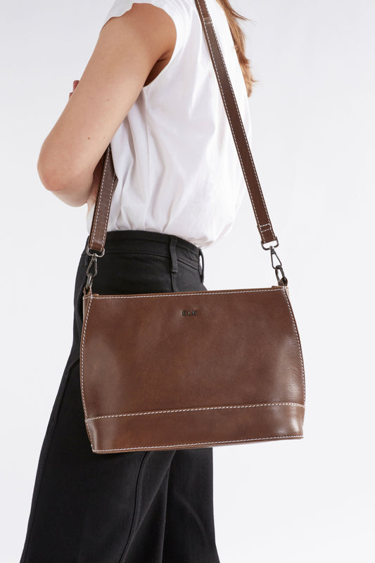 Fika Mid Sized Leather Zip up Handbag Front model | TAN