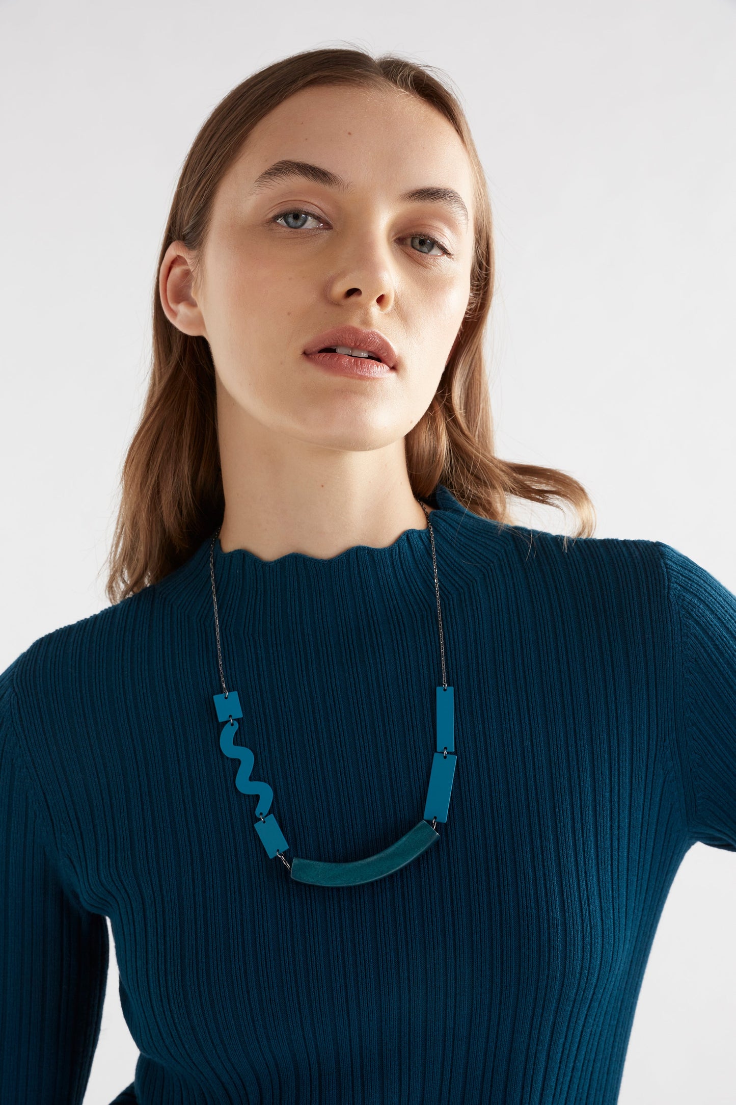 Silka Slim Fit Ribbed Funnel Neck Scalloped Sweater Model Front Detail with Necklace | TEAL BLUE