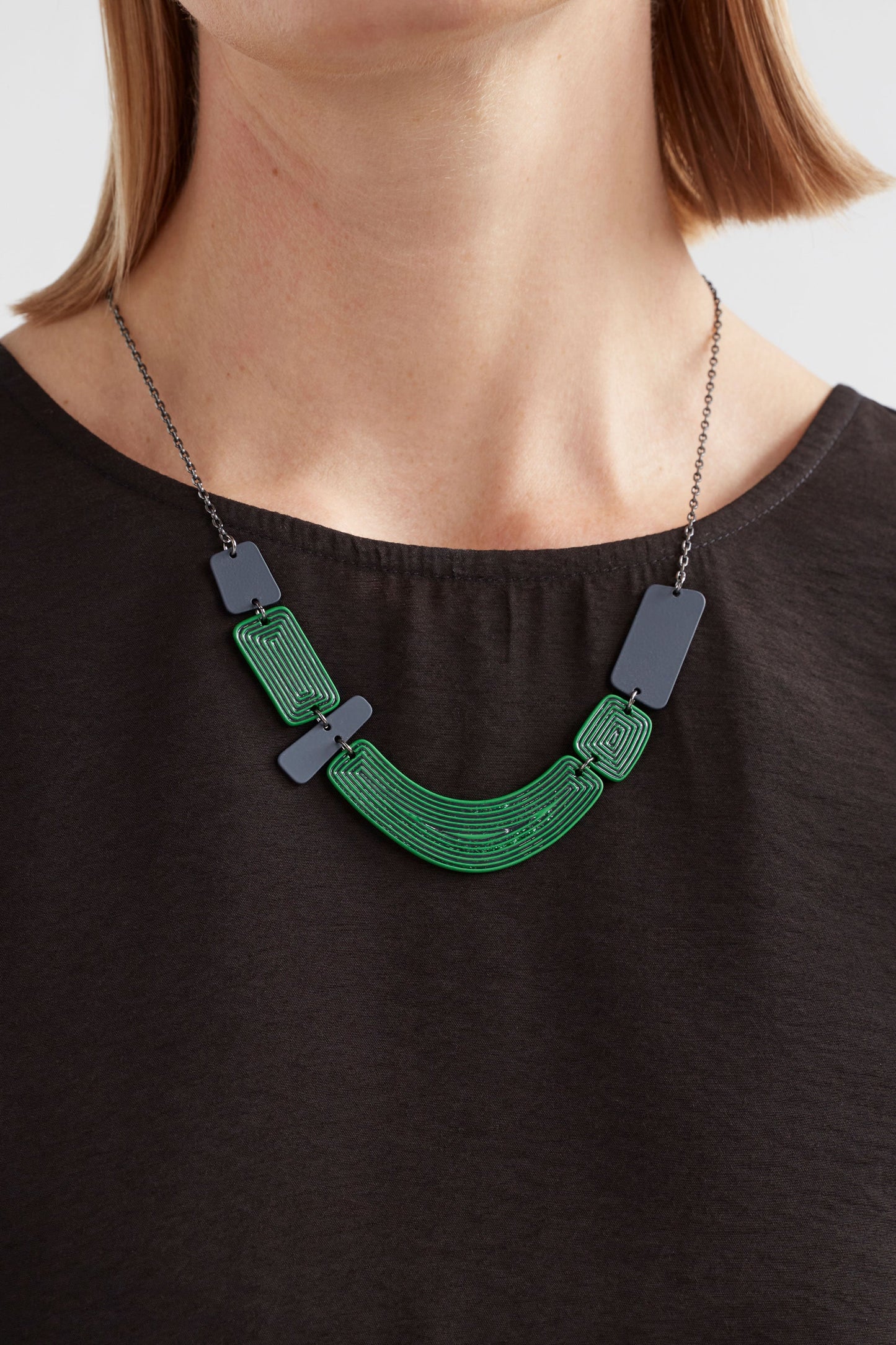 Kaiva Chain and Colour Coated Geometric Statement Mid Length Necklace Model detail | VINE GREEN