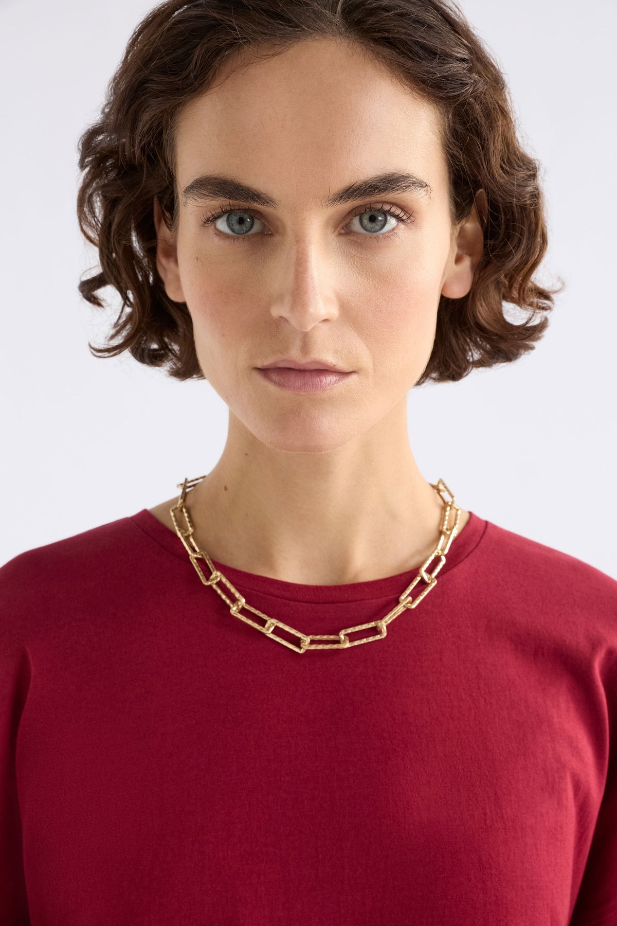 Ringva Necklace on model styled with red tshirt | GOLD