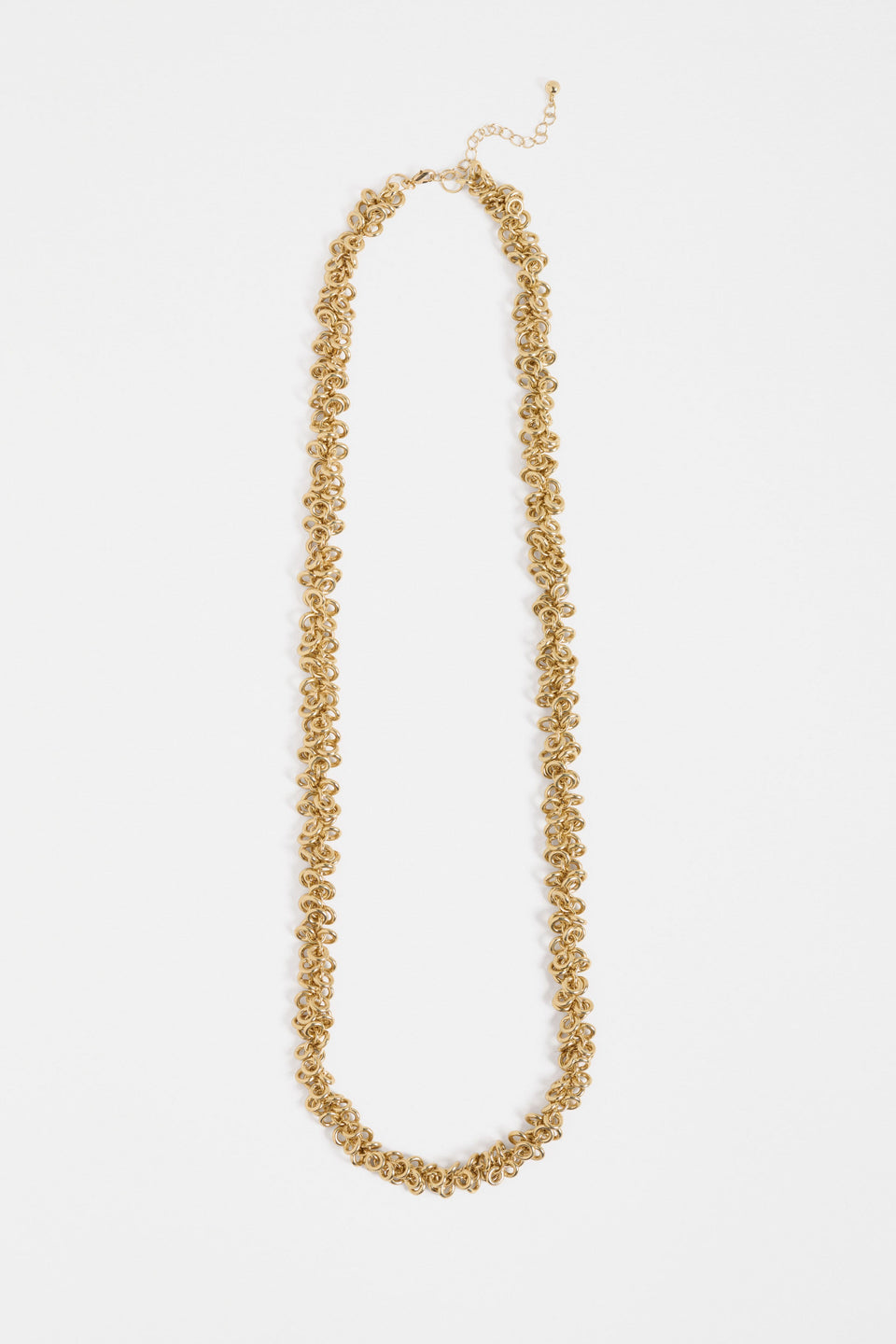 The Hava Necklace features layered metallic jump rings forming a thick, textured chain with sculptural impact ELK | GOLD