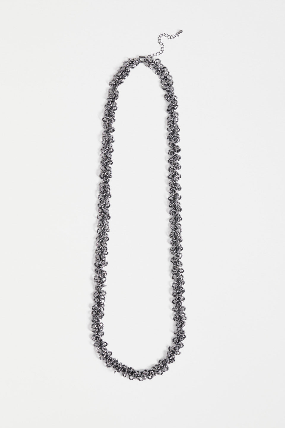 The Hava Necklace features layered metallic jump rings forming a thick, textured chain with sculptural impact ELK | GUNMETAL