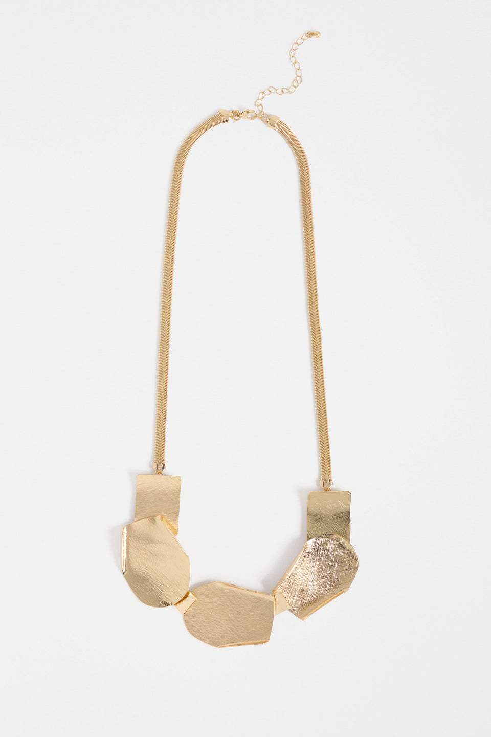 Villt Necklace features sculptural metal shapes with subtle folds and a brushed crosshatched finish for bold, artistic impact ELK | GOLD