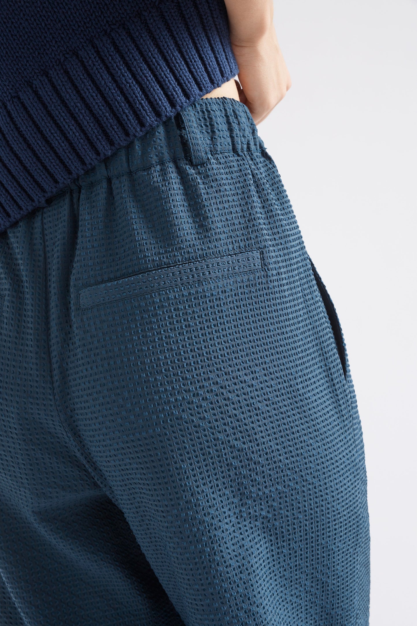 Deor Front Pleat Straight Leg Textured Pant Model Back Detail | DEEP SEA BLUE