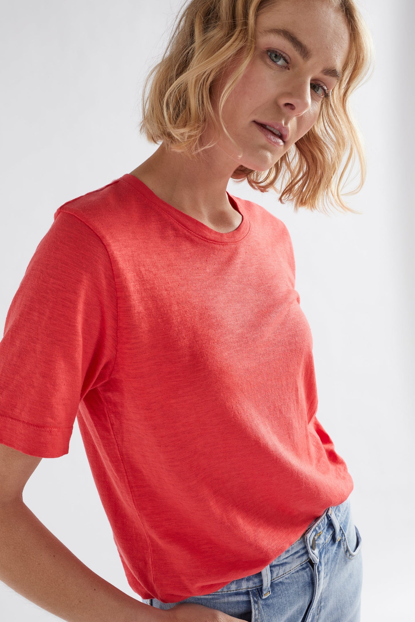 Jaana Organic Cotton and Hemp Jersey Crew Neck Tshirt Model Front Tucked detail  | CORAL