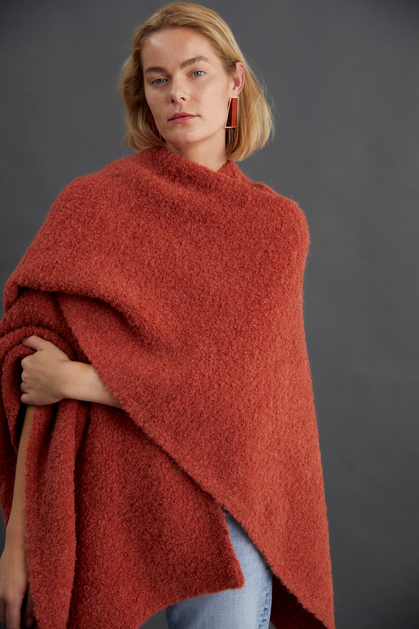 Tukko  Alpaca-Wool Boucle Knit Handkerchief Hem Poncho Wrap Studio Model Front | CINNAMON