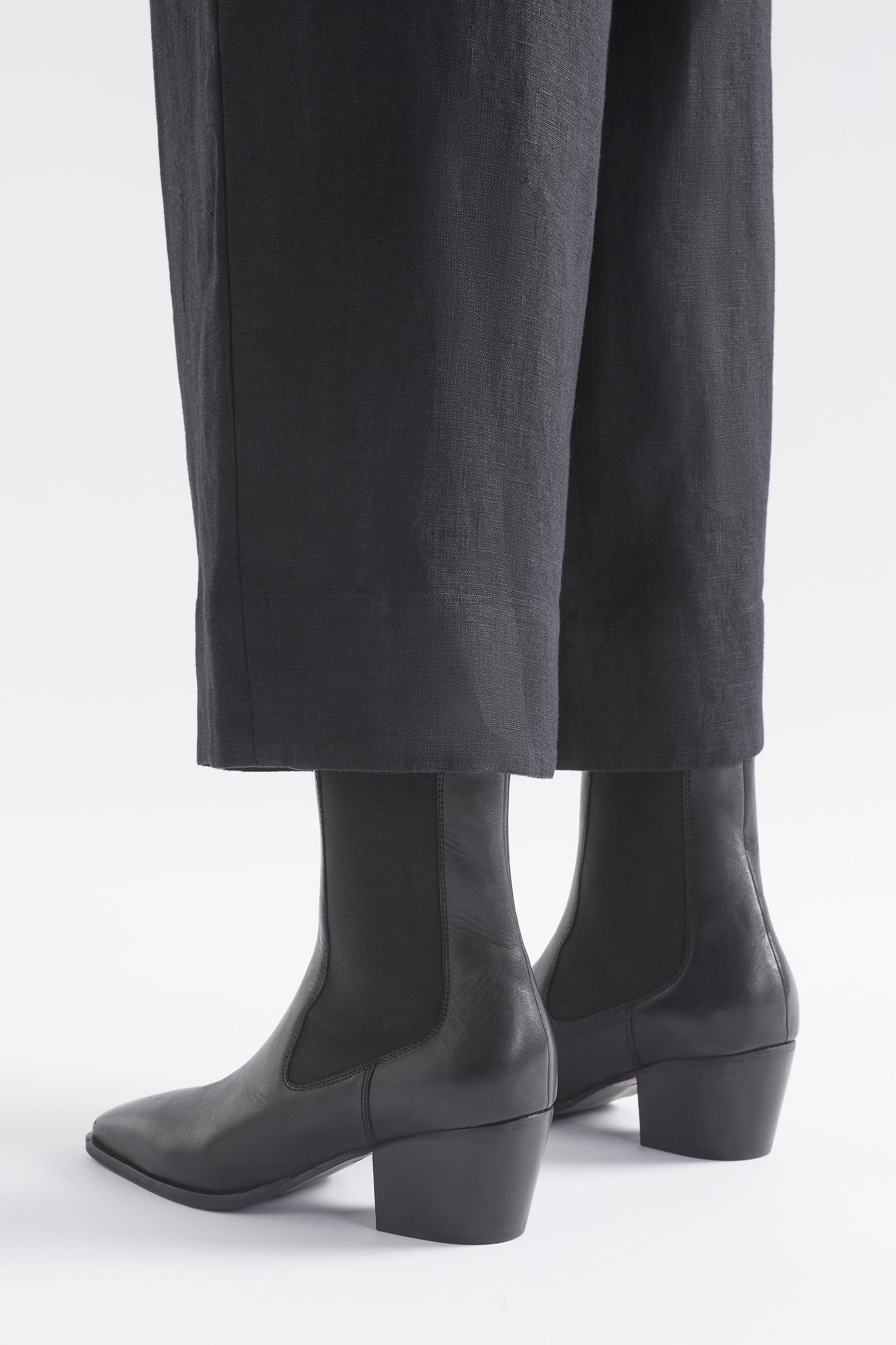 Vastra Pointed Square Toe Mid Heel Leather Slip on Boot Angled Back Model | BLACK