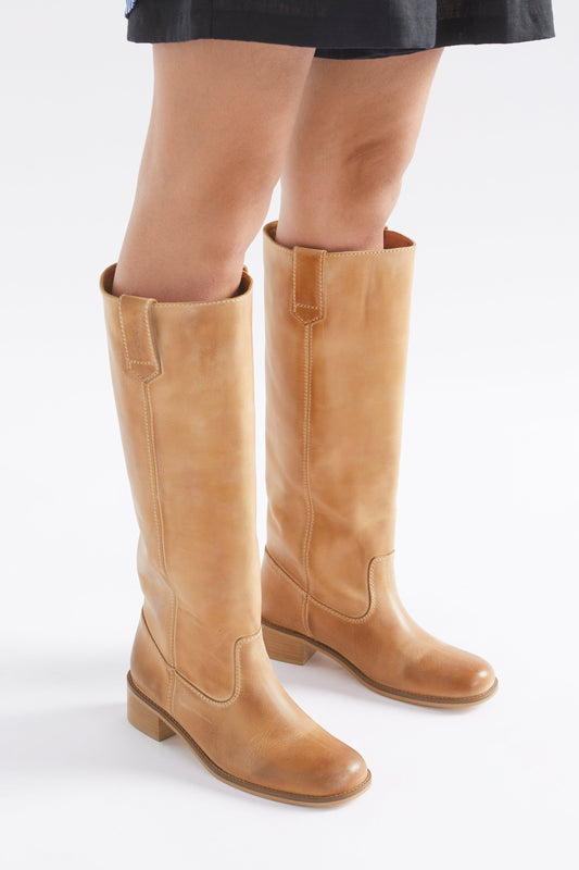 Anna Escovado Natural Worn Look Knee High Leather Boots Angled Front on model  | TAN