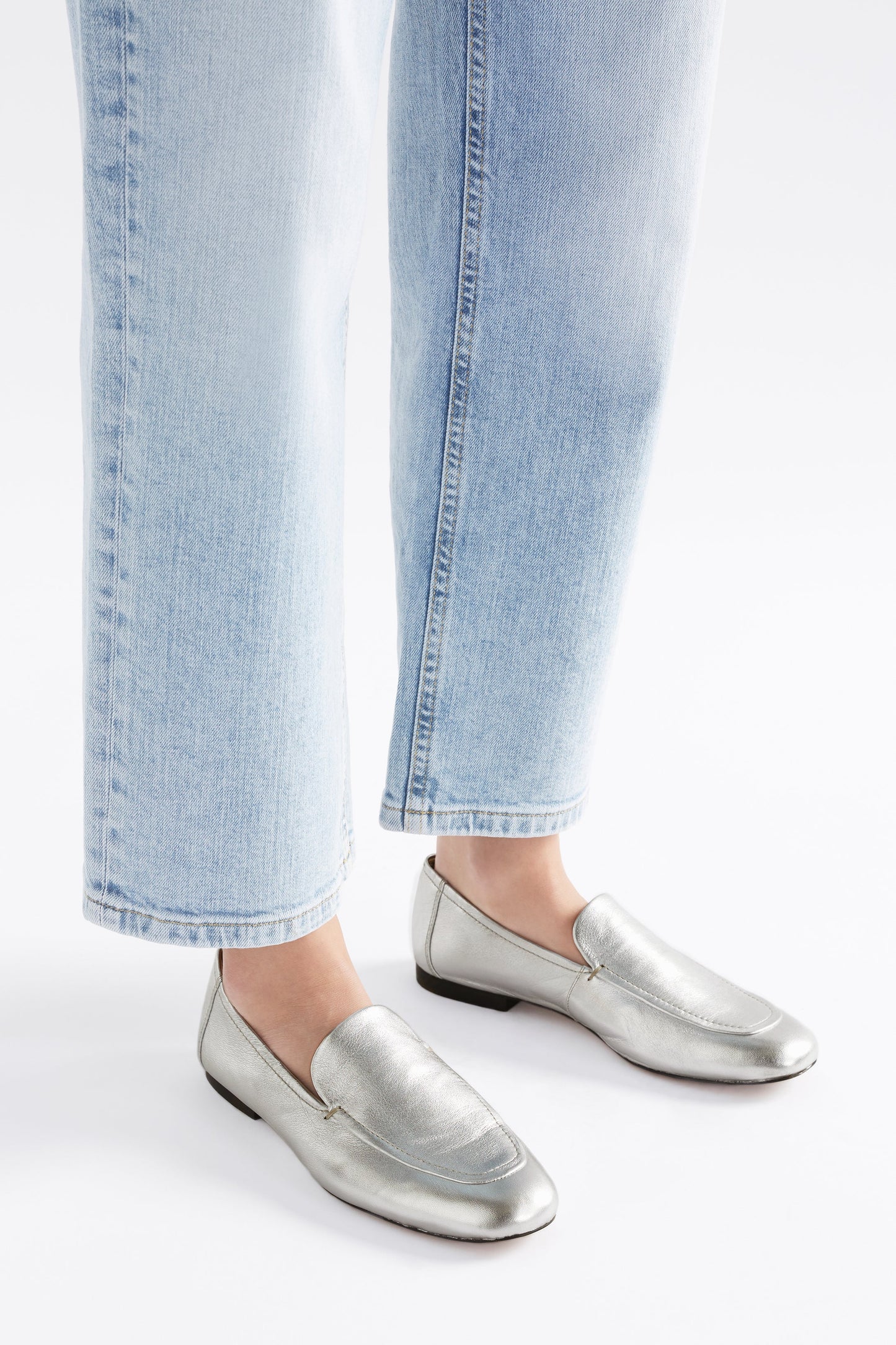 Clift Metallic Silver Leather Flat Loafer Angled Front Model | SILVER