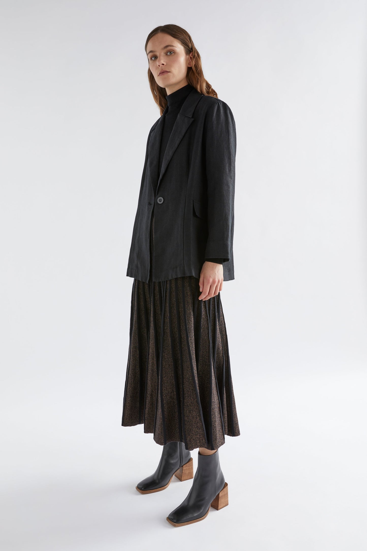 Glittra Lurex Knit Metallic A-Line Skirt Model Full Body with Ilona Blazer | GOLDEN METALLIC