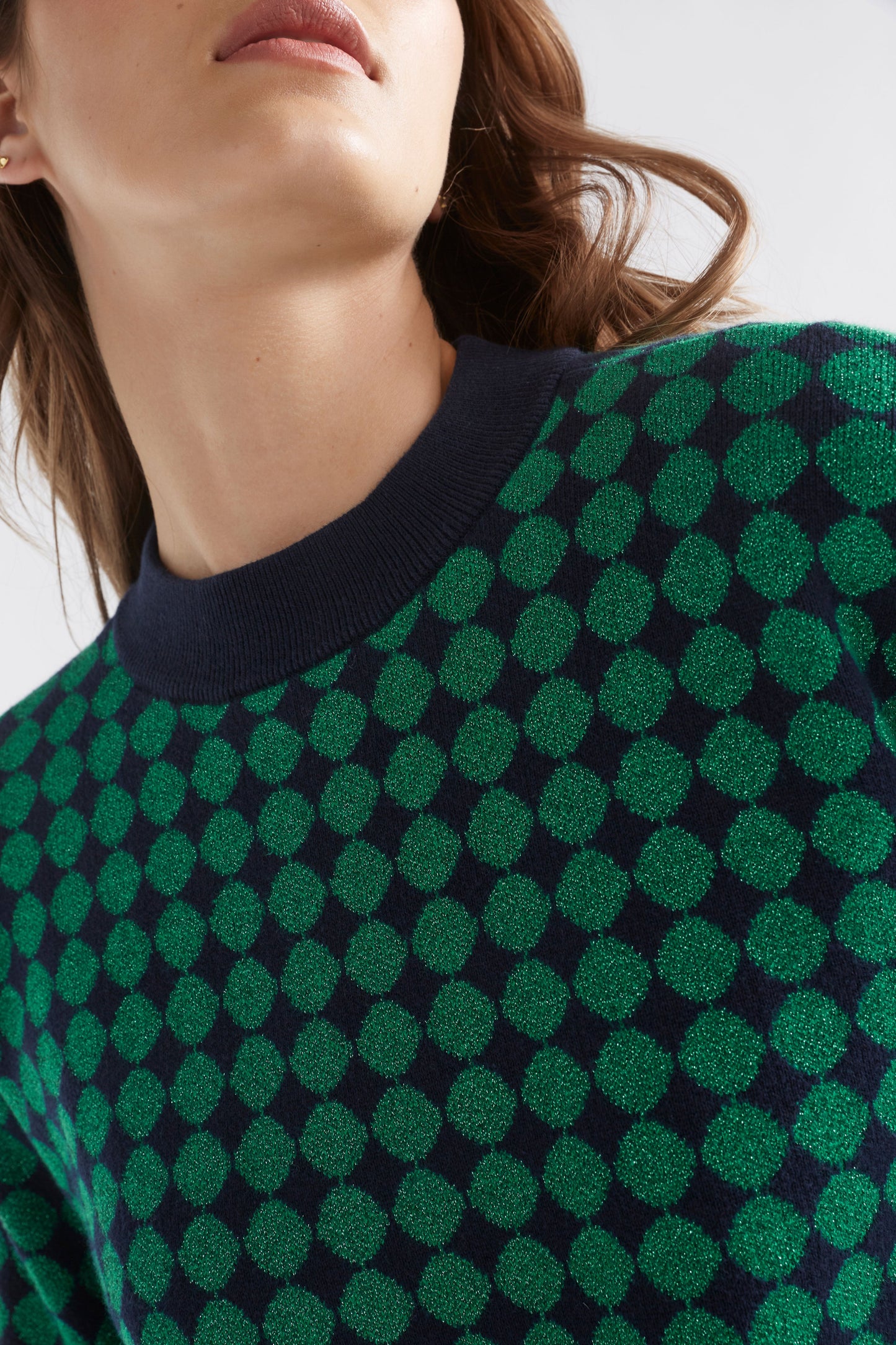 Leira Mock Turtle Neck Dropped Sleeve Metallic Circle Knit Sweater Model Front Detail | NAVY GREEN METALLIC