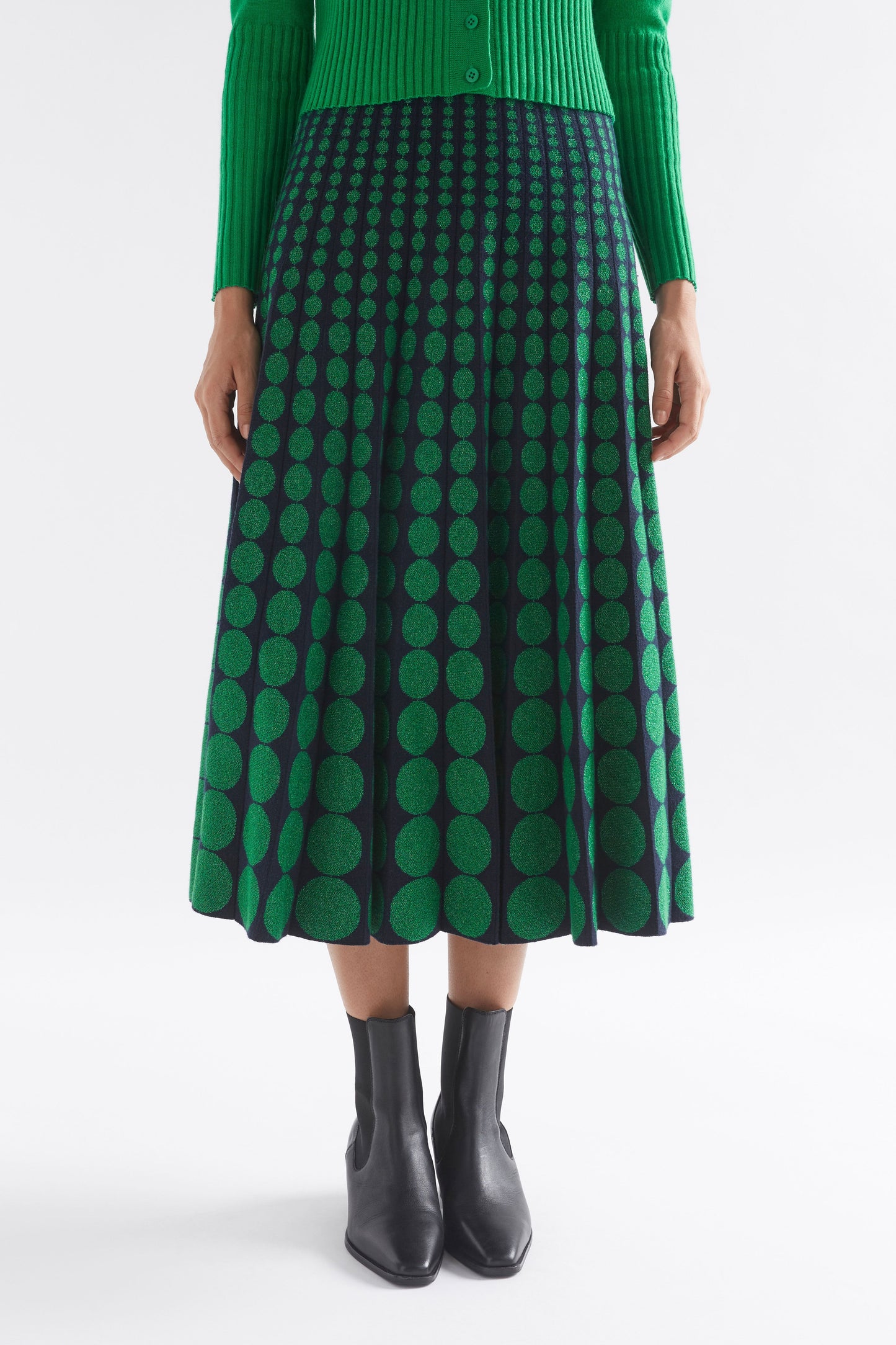 Leira A-Line Midi Metallic Knit Skirt with Circle Design Model Front | NAVY GREEN METALLIC