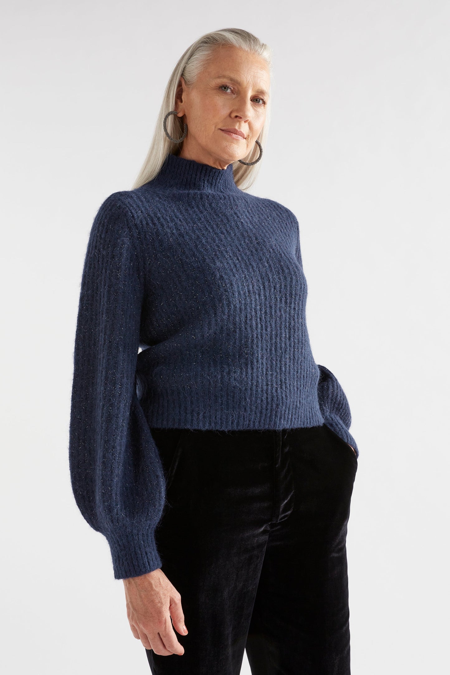 Kaanto Puff Sleeve Cropped Ribbed Turtle Neck Sweater Model Angled Front | NAVY