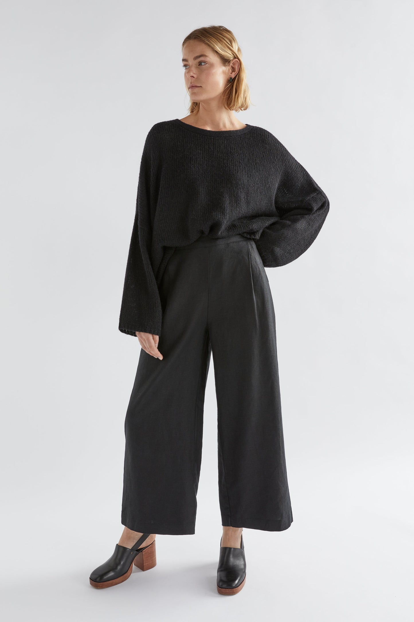 Anga Relaxed Box Fit Alpaca Yarn Knit Sweater Model Front Tucked Jess full body | Black