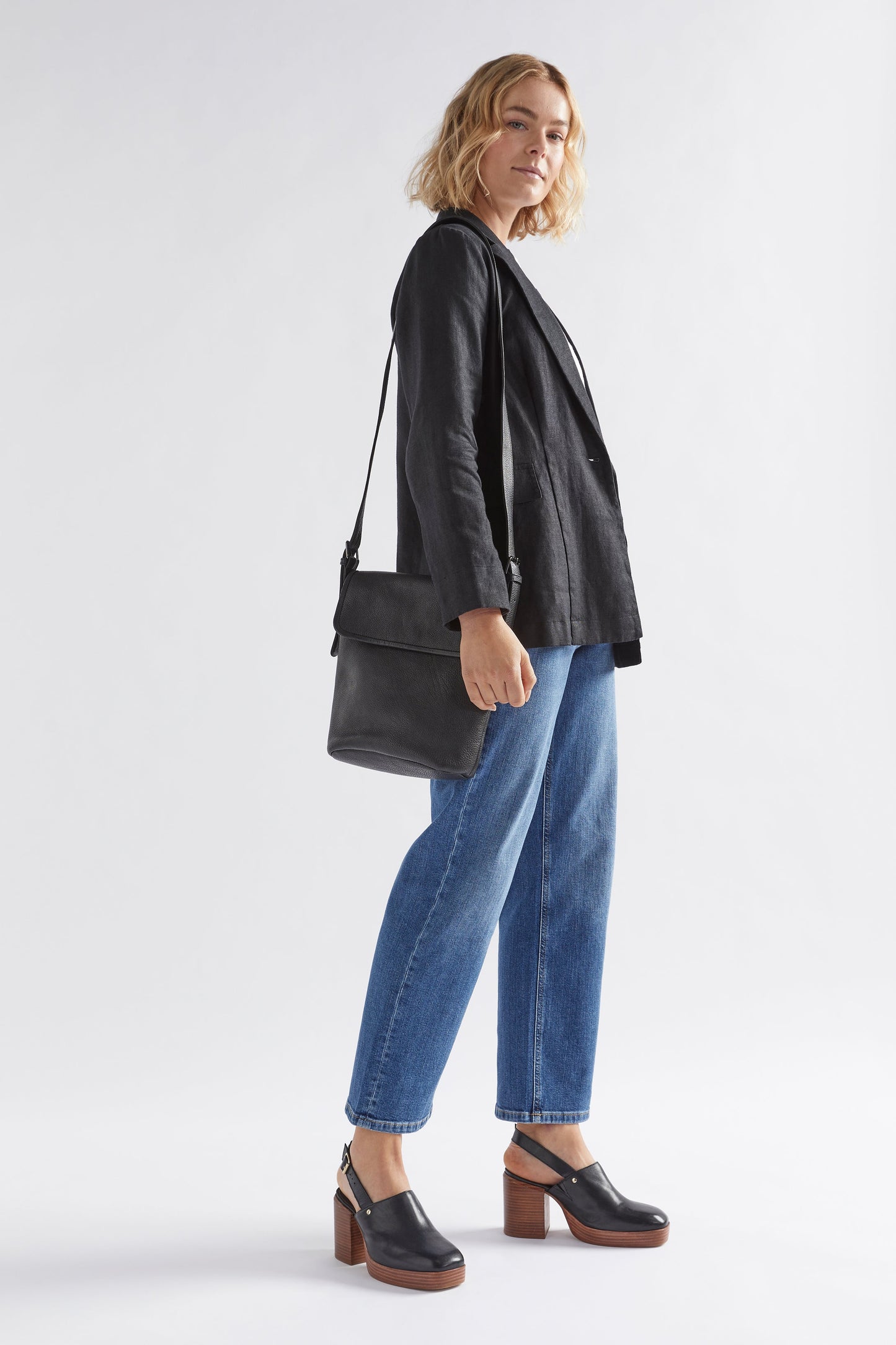 Teo Medium sized Leather Crossbody Bag with flap full body modelBLACK
