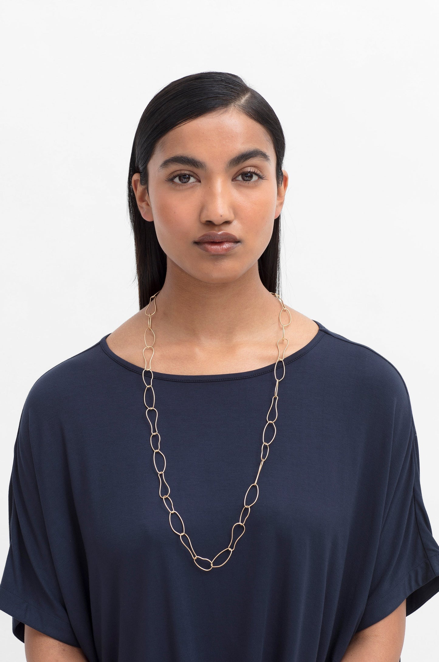 Niika Fine Organic Shaped Chain Coated Metal Necklace model | GOLD